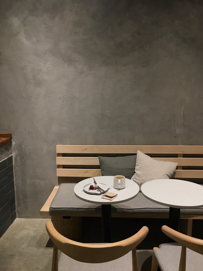 Warm coffee and slice of cake on a minimalistic café table in Ankara, Türkiye.