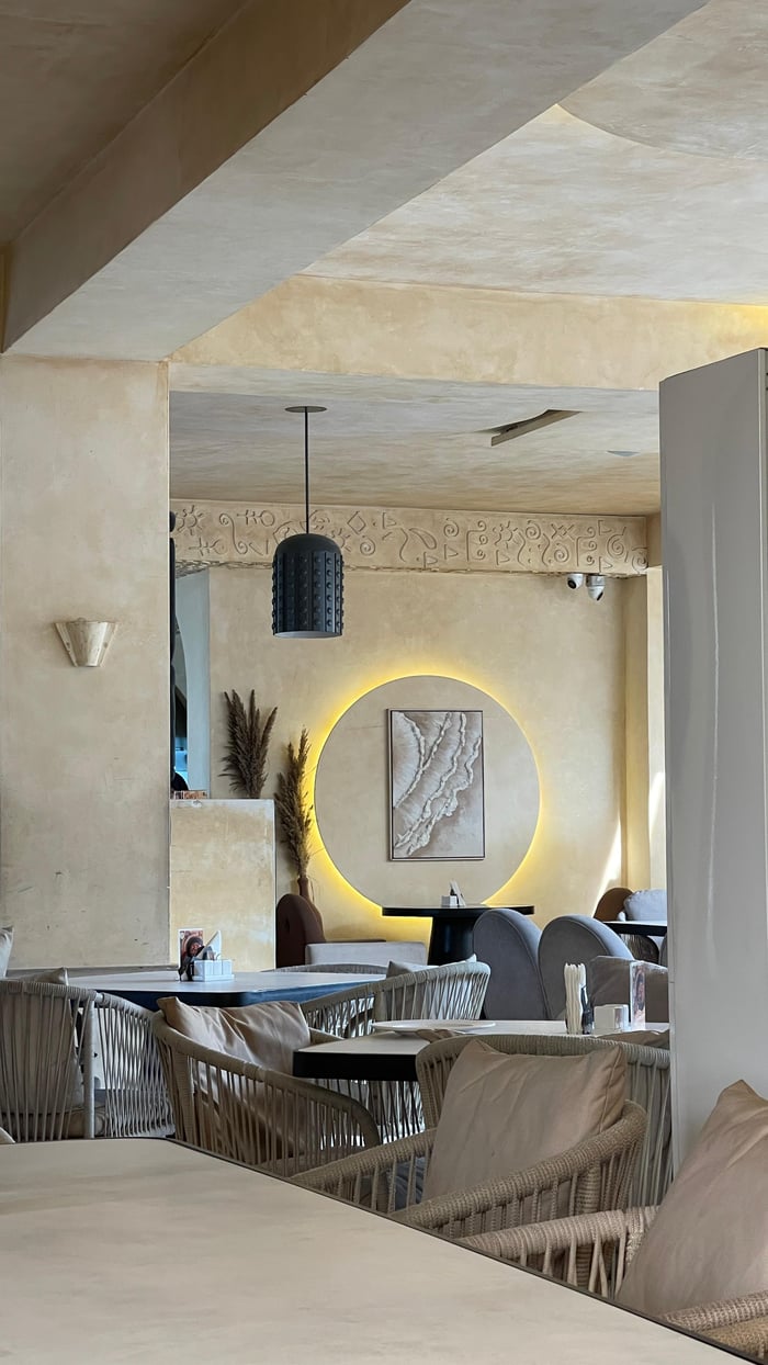 services-04 A stylish and contemporary restaurant interior with soft lighting and modern furniture.