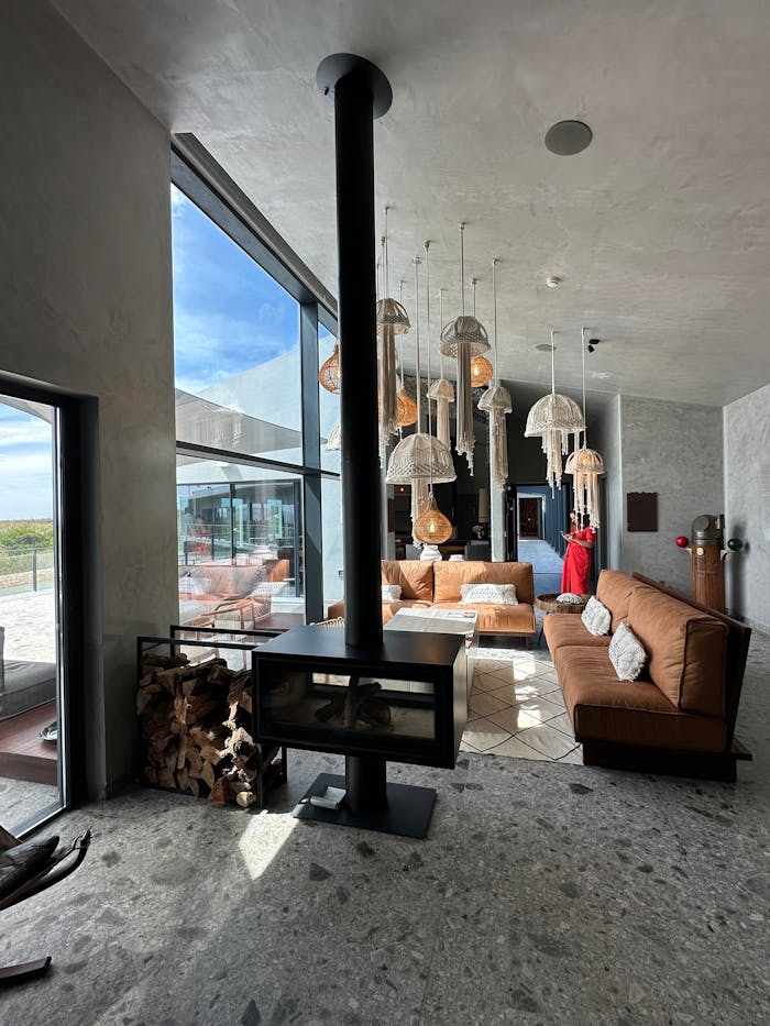 Crafting Captivating Headlines: Your awesome post title goes here Spacious modern living room featuring large windows with an ocean view, natural lighting, and stylish decor.